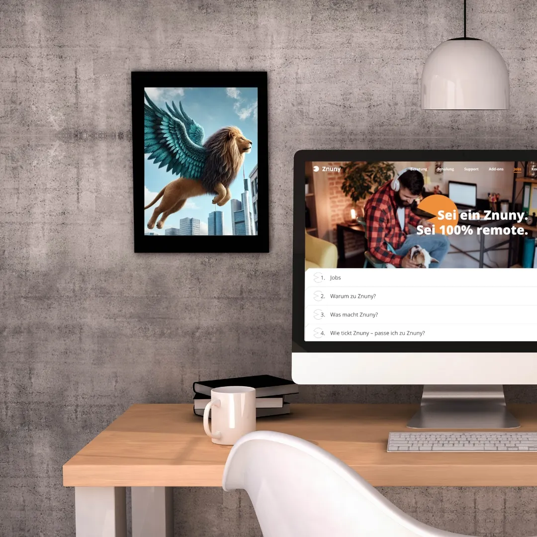 Schreibtisch mit Monitor, der eine Karriereseite zeigt, an der Wand ein Bild eines geflügelten Löwen